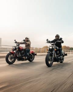 Pair of Indian motorcycles cruising along the highway for riders seeking speed, power, and style on long-distance rides