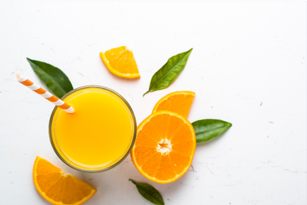 A glass of orange juice viewed from above