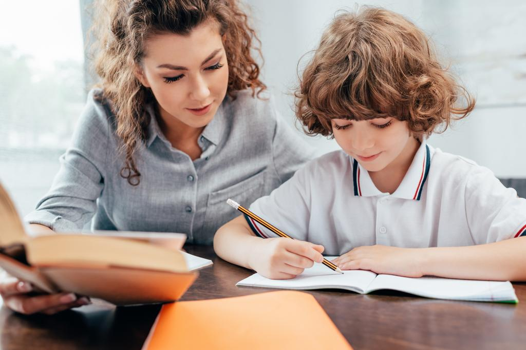 tutor helping a student with english worksheets in a geelong tuition