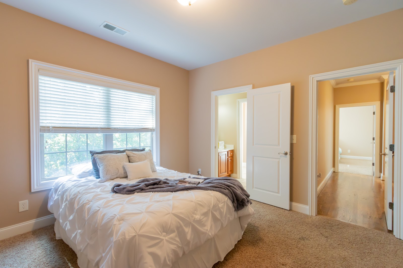 Stage a room by keeping it simple. You want to show buyers how much space there is.