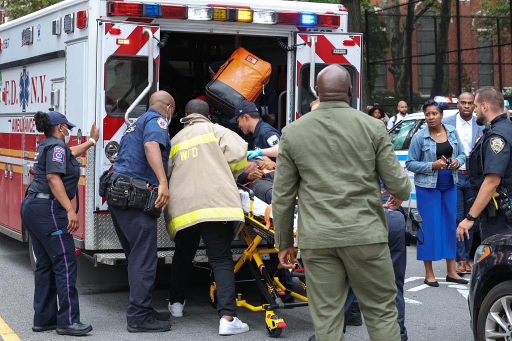 Unique Smith, 15, is brought into an ambulance to be taken to Brooklyn Methodist Hospital, where he was pronounced dead.
