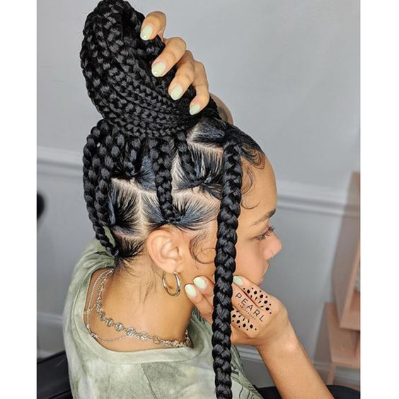 Another look of a girl rocking the jumbo sized braids in a bun