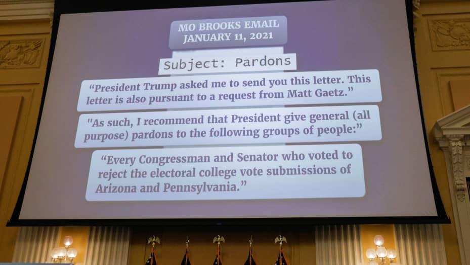 Extracts from an email by U.S. Rep. Mo Brooks (R-AL) to former White House Chief of Staff Mark Meadows asking for pardons for members of Congress are shown on a screen during the fifth public hearing of the U.S. House Select Committee to Investigate the January 6 Attack on the United States Capitol, on Capitol Hill in Washington, U.S., June 23, 2022. REUTERS/Jim Bourg