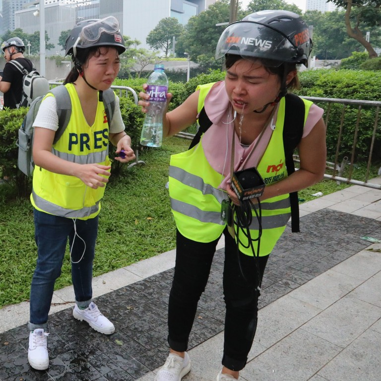 periodistas-de-Hong-Kong-Holmes-protestas-manifestantes-