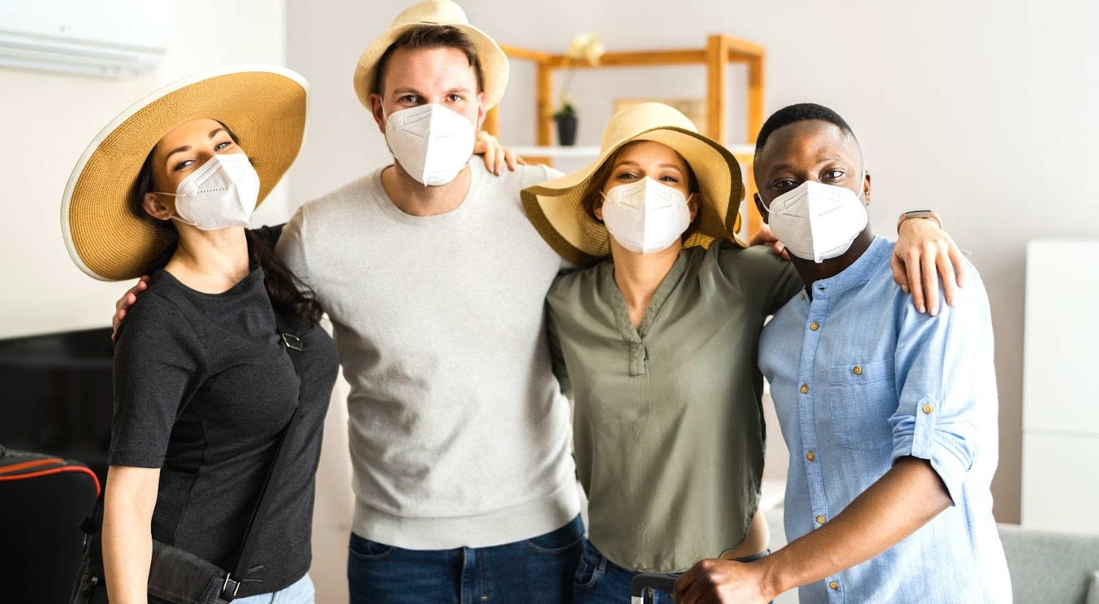 Group of friends wearing masks preparing to travel