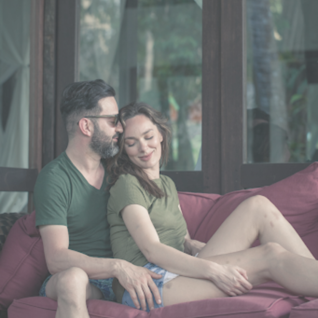 Photograph of a couple have a photoshoot in a resort staycation Australia