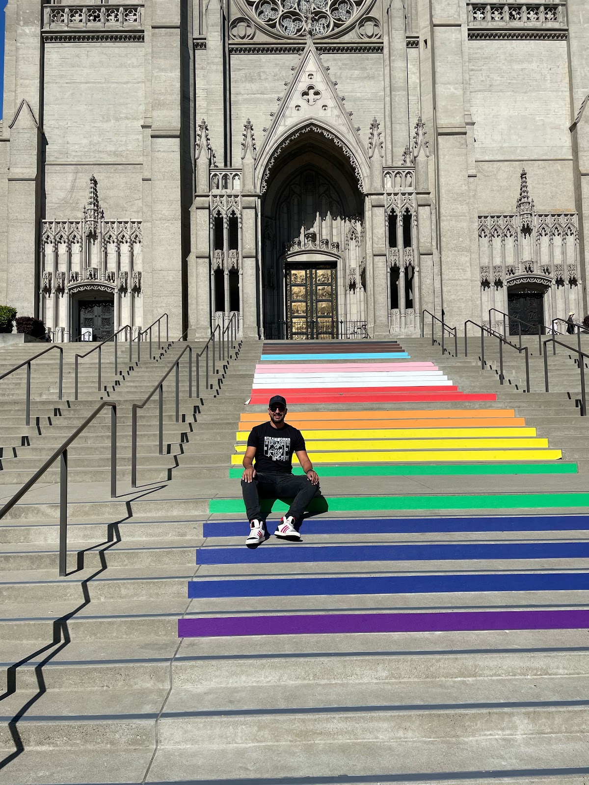 Gay male posing on rainbow steps in San Francisco during Dore Alley 2023