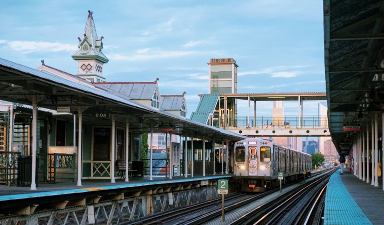 A public transit train arriving at a station in Chicago.