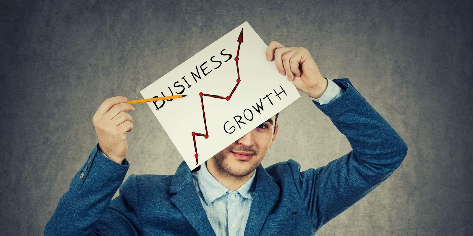 man holding a business growth sign
