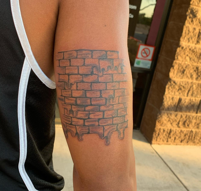 Melting The Brick Wall Tattoo Symbol