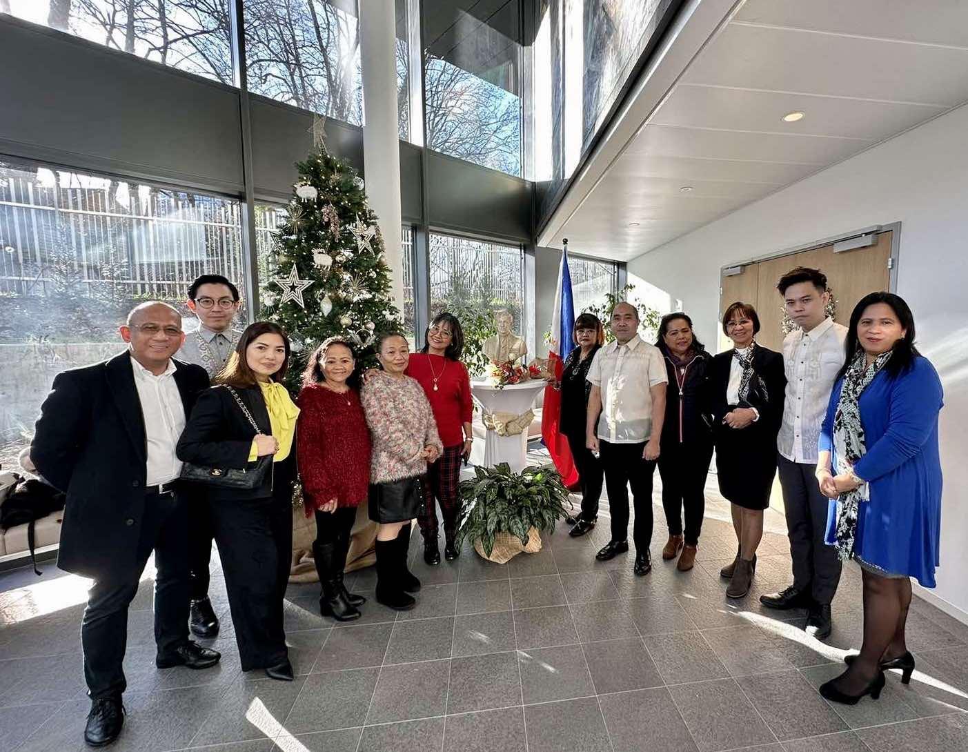 A group of people posing for a photo

Description automatically generated