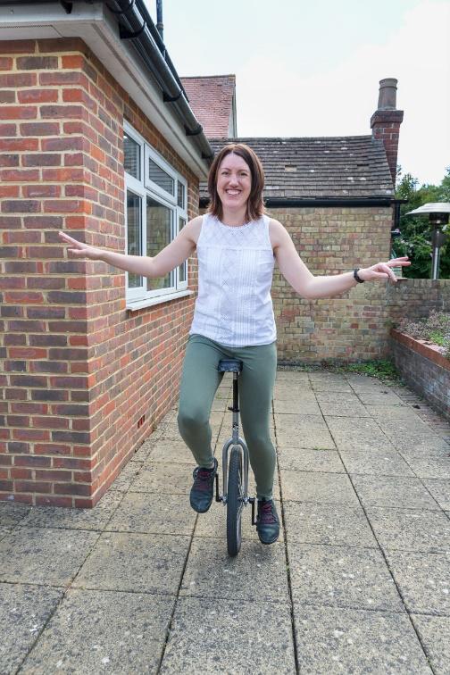 Sarah riding a unicycle