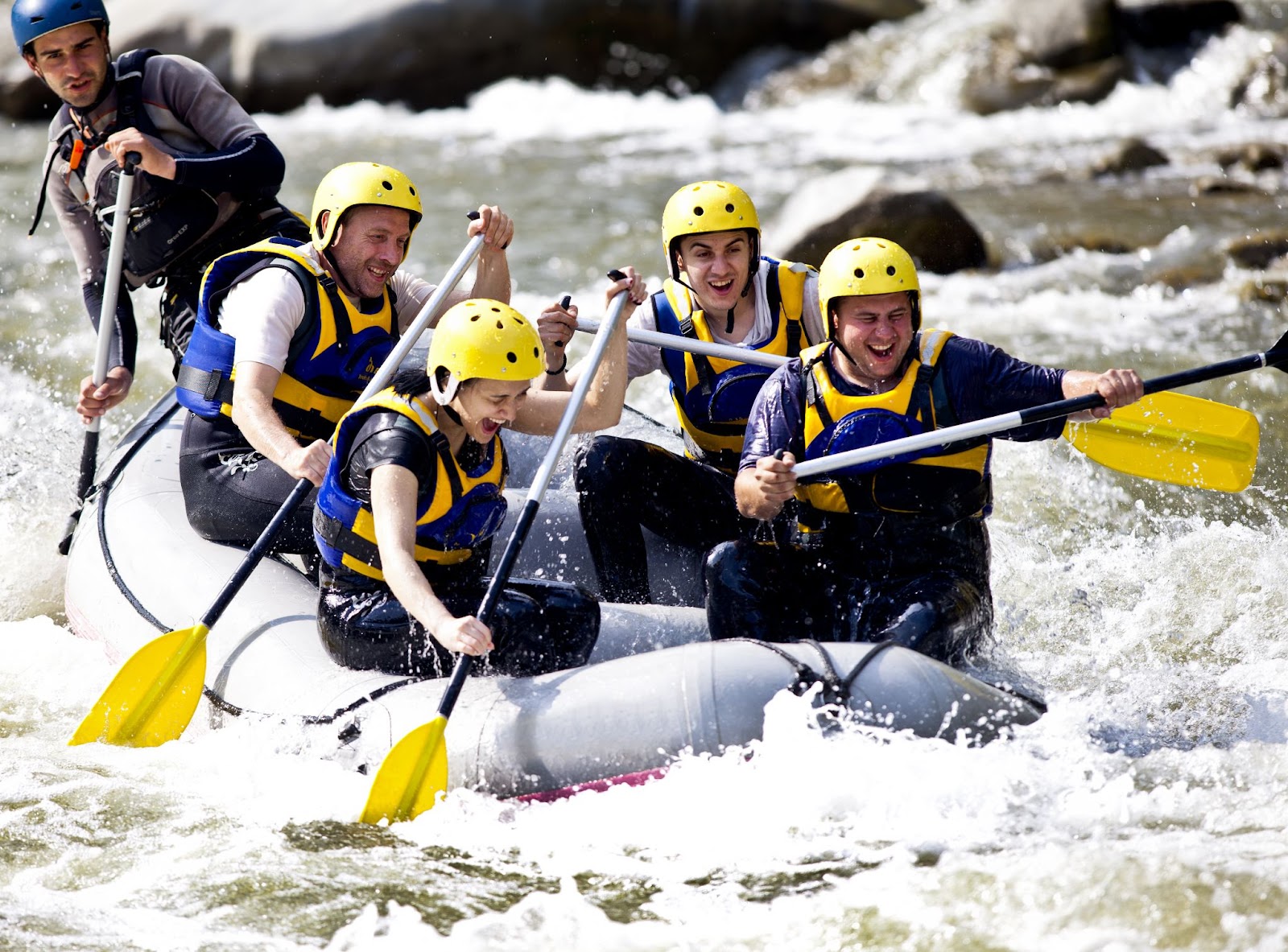 five people having an awesome time rafting along the snowy river