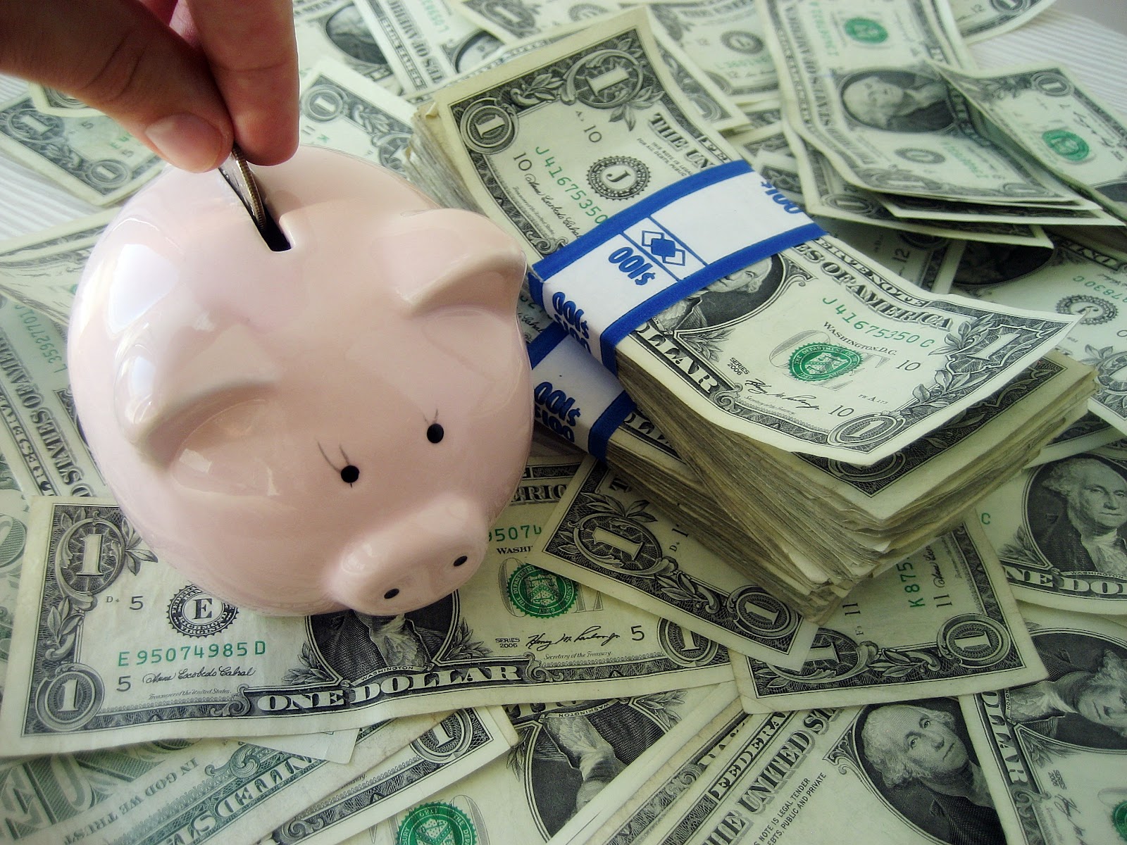 File:Putting money into a