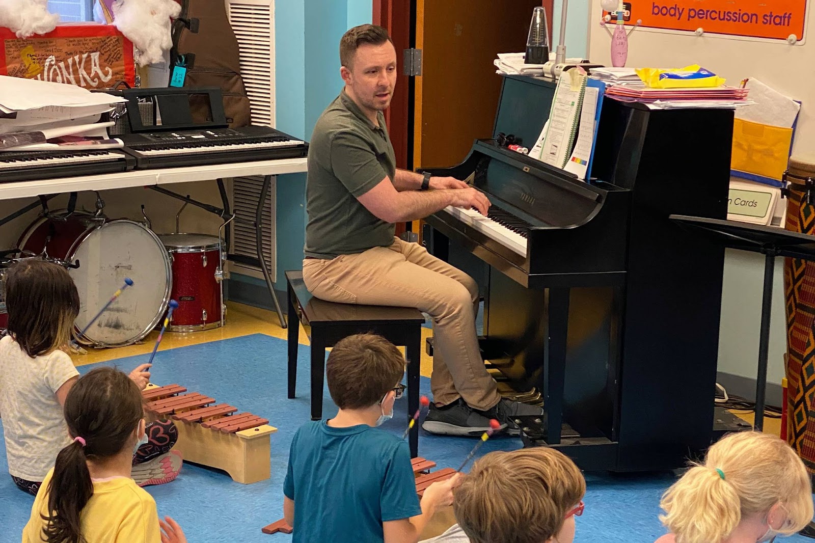 music teacher at piano