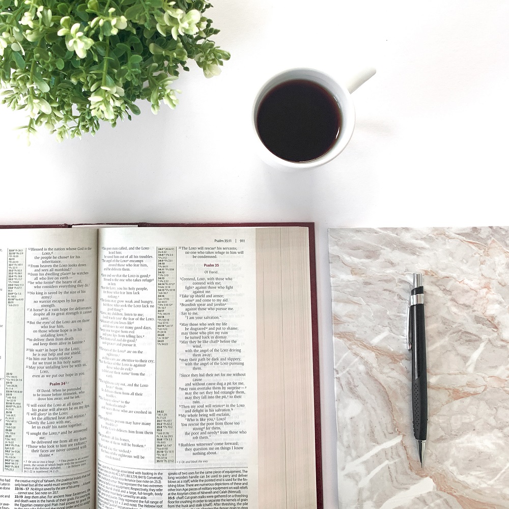Open bible with pen spiritual journaling