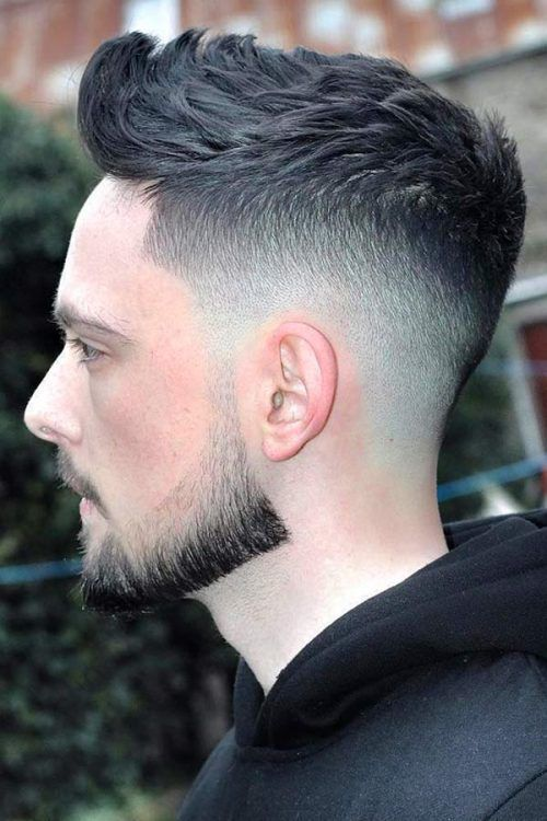 a white man with beards wearing a fade haircut