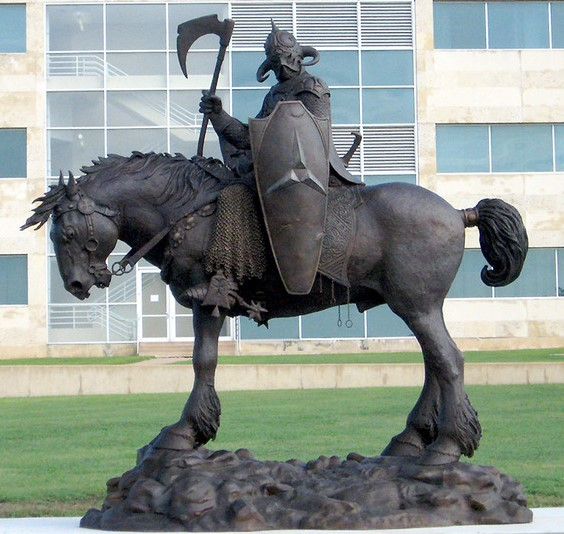 A statue of a person riding a horse

Description automatically generated