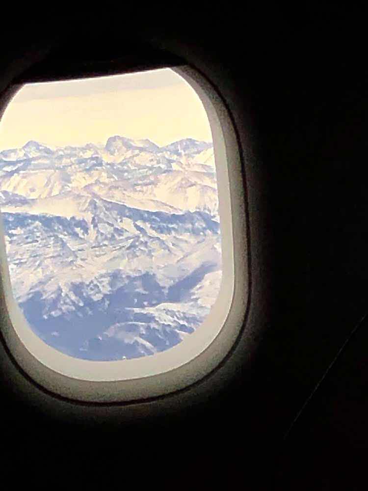 on the other side of the aircraft, the snow capped Andes were visible