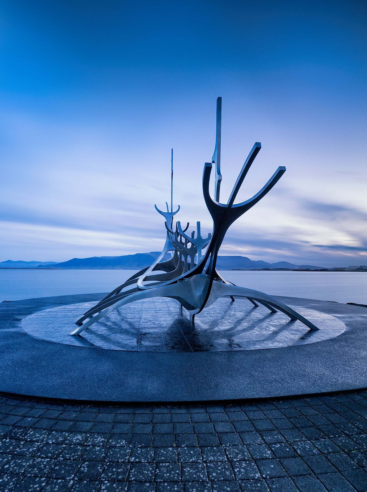1 day in Reykjavik, Sun Voyager sculpture facing the mountains. This is a sculpture to convey a dream of hope, progress, and freedom.