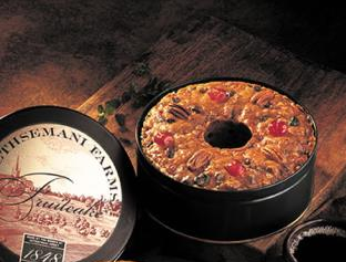 fruitcake in a black tin on a table