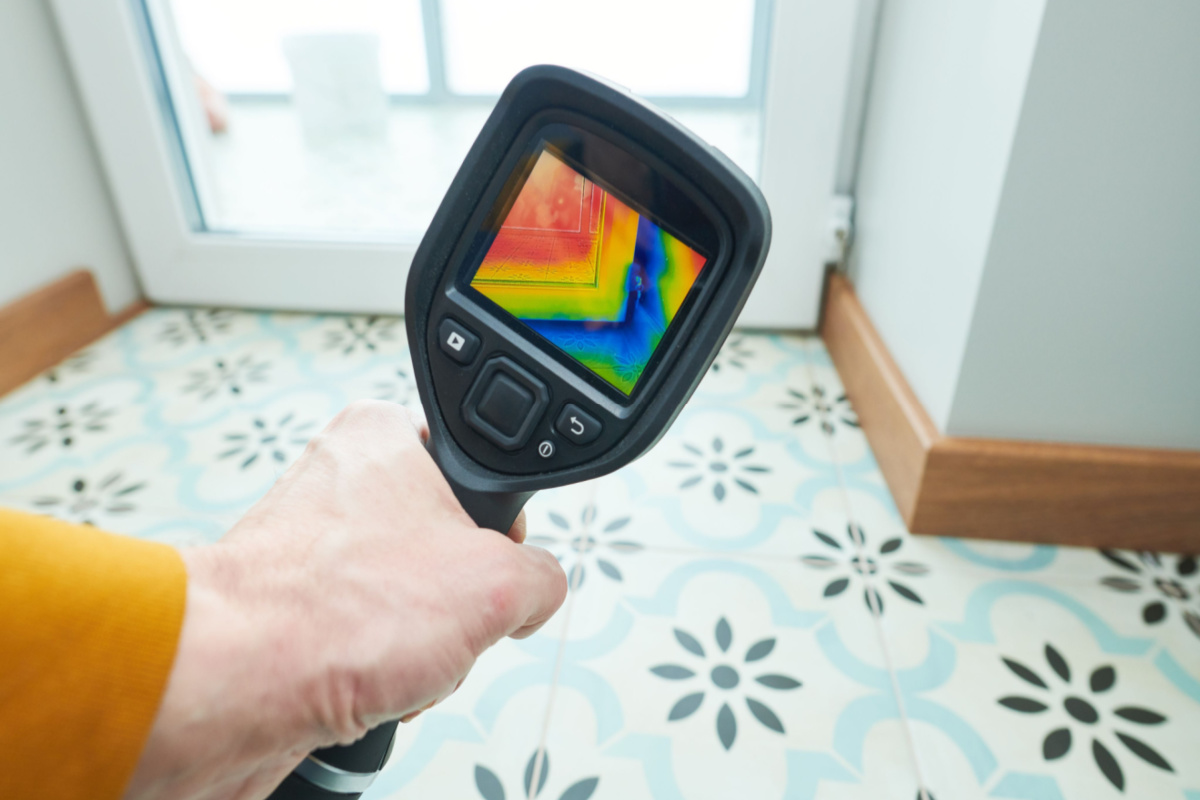 A homeowner using an infrared camera.