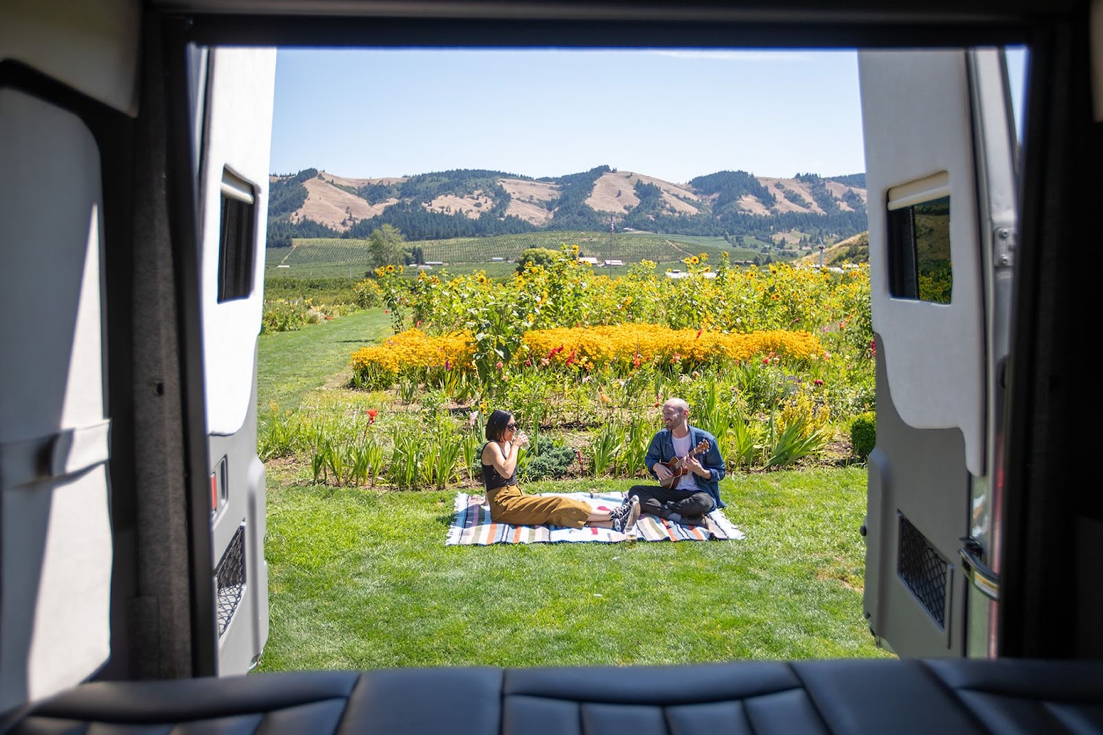 Campervan couple in a vineyard