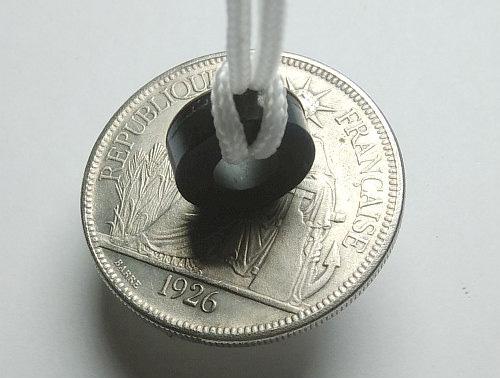 counterfeit-coin-detected-with-a-magnet.jpg