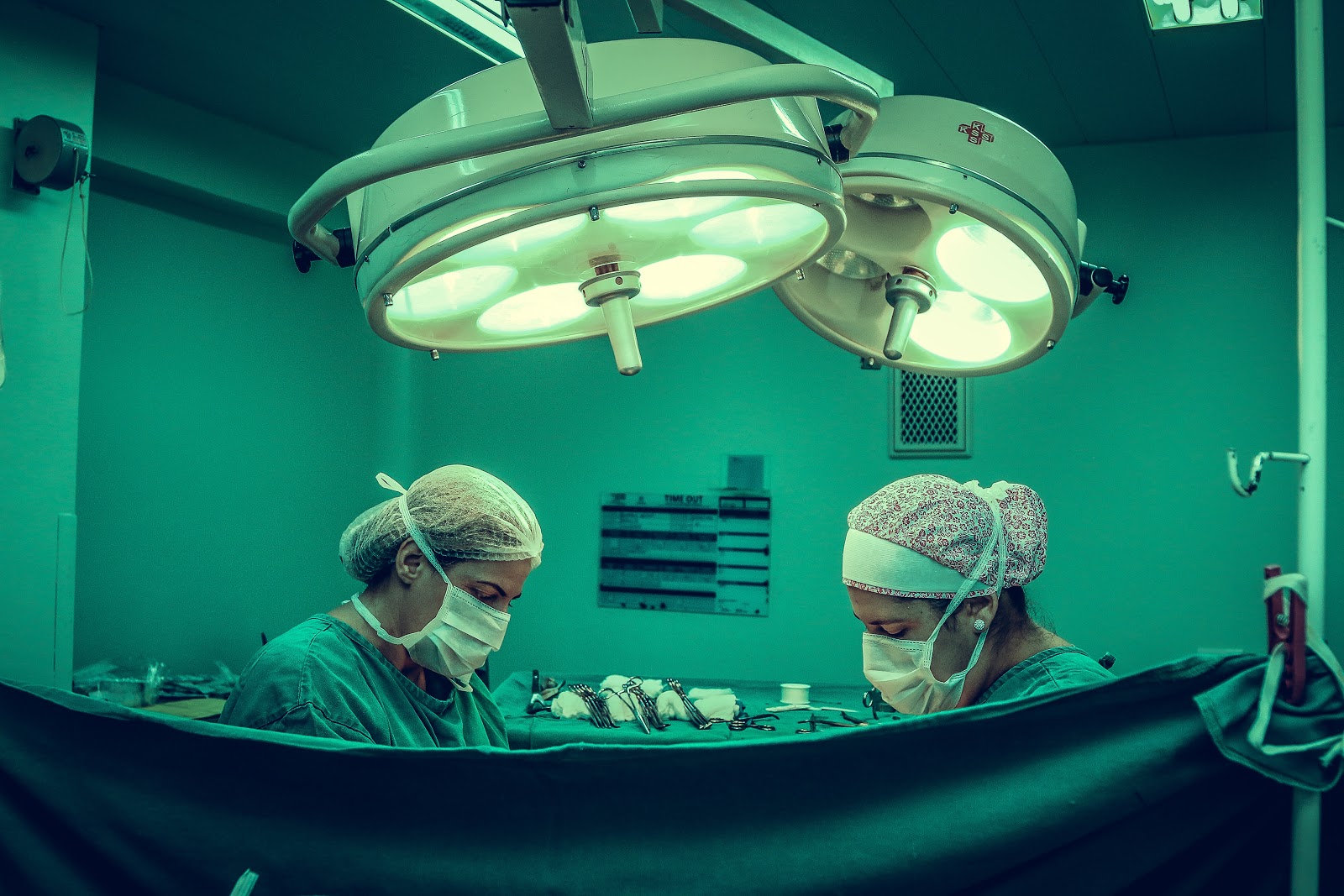 Two people performing surgery