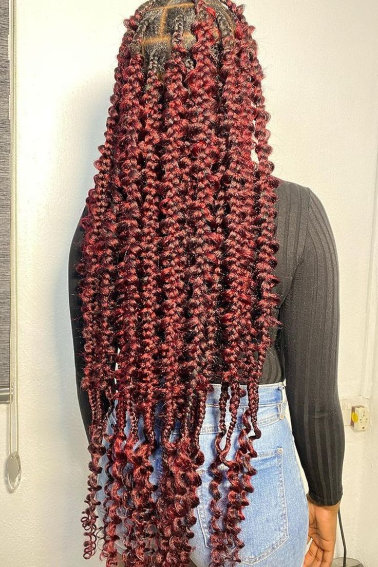 back view of a lady with red butterfly braids