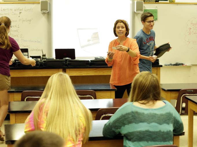 Photo of teacher in classroom.