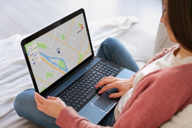 Free photo high angle woman holding laptop