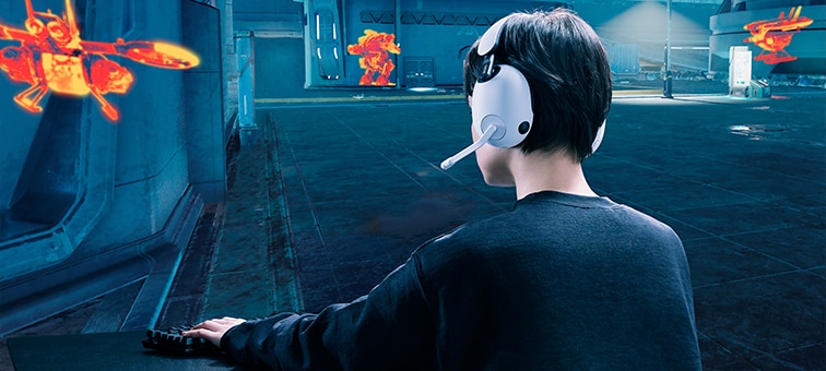Boy wearing INZONE H7 headset in a game scene showing buildings and hidden targets highlighted in orange