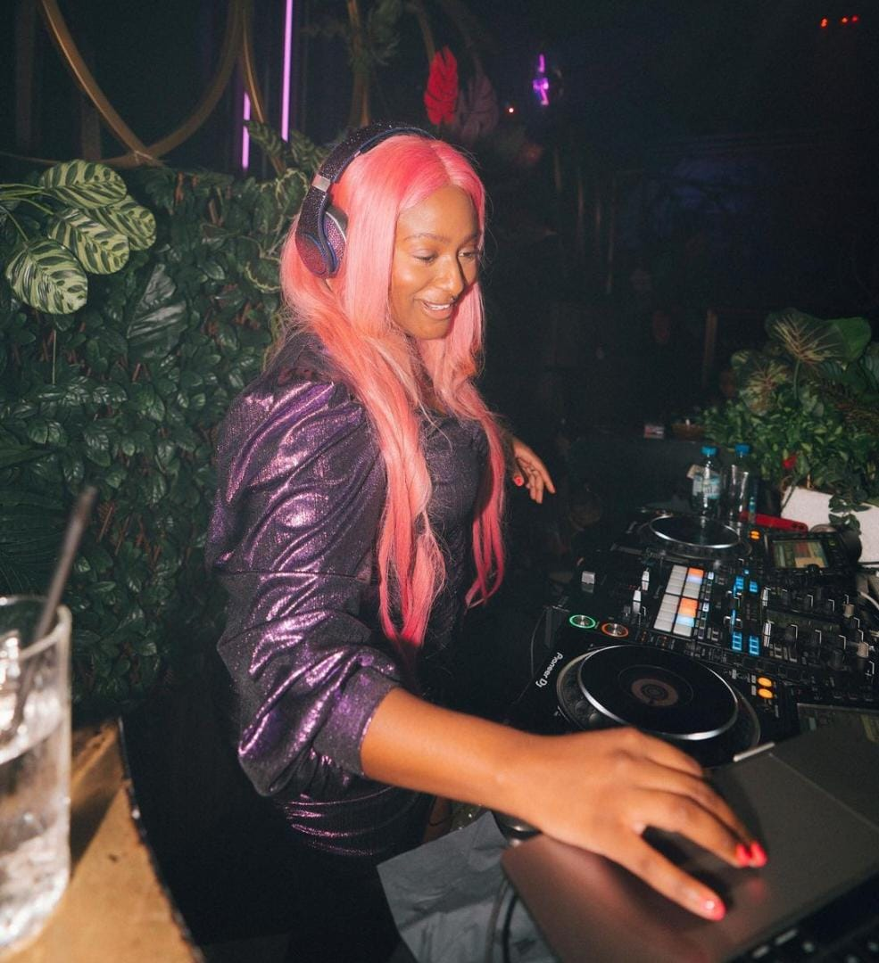 DJ Cuppy in her signature style pink wig