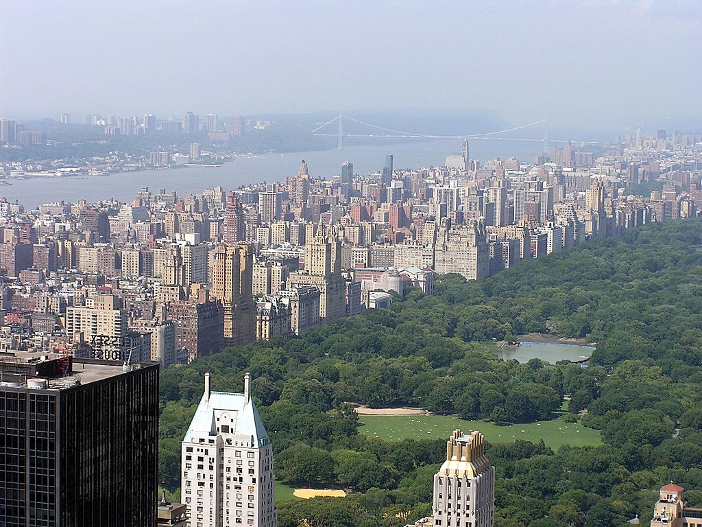 The Upper West Side on the left, and Central Park on the right, as seen from the Top of the Rock observatory at Rockefeller Center. In the distance is the Hudson River on the far left, and the George Washington Bridge in the background.