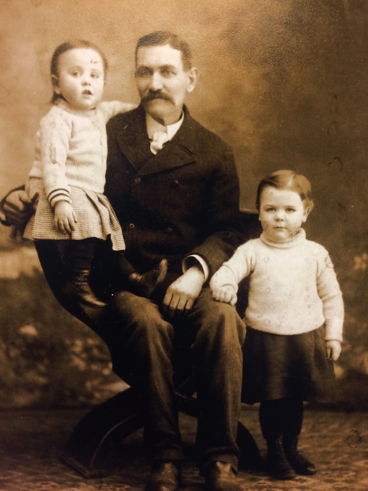 Thomas McDonald, holding grandson Tom Martin, with grandson Reg Whalley next to him.jpg