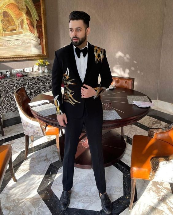 a man wearing an embellished dinner jacket prom outfits for men