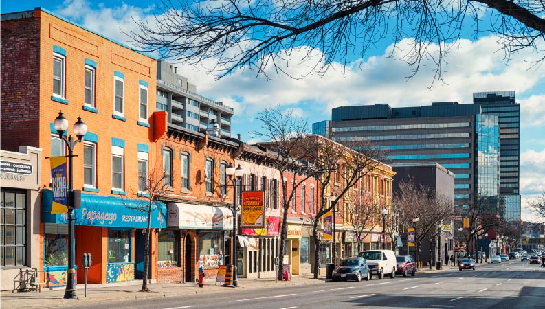 Photo of colourful restaurants and businesses on King Street West in downtown Hamilton, Ontario, Canada.
