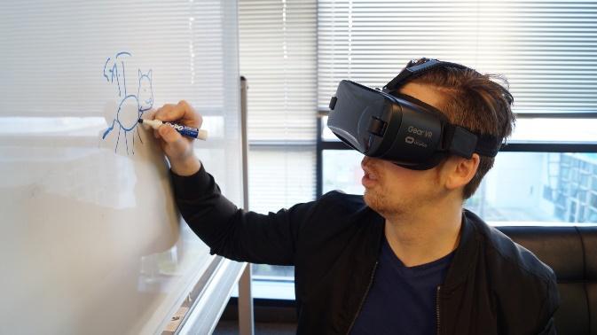 A person wearing a virtual reality headset

Description automatically generated with low confidence