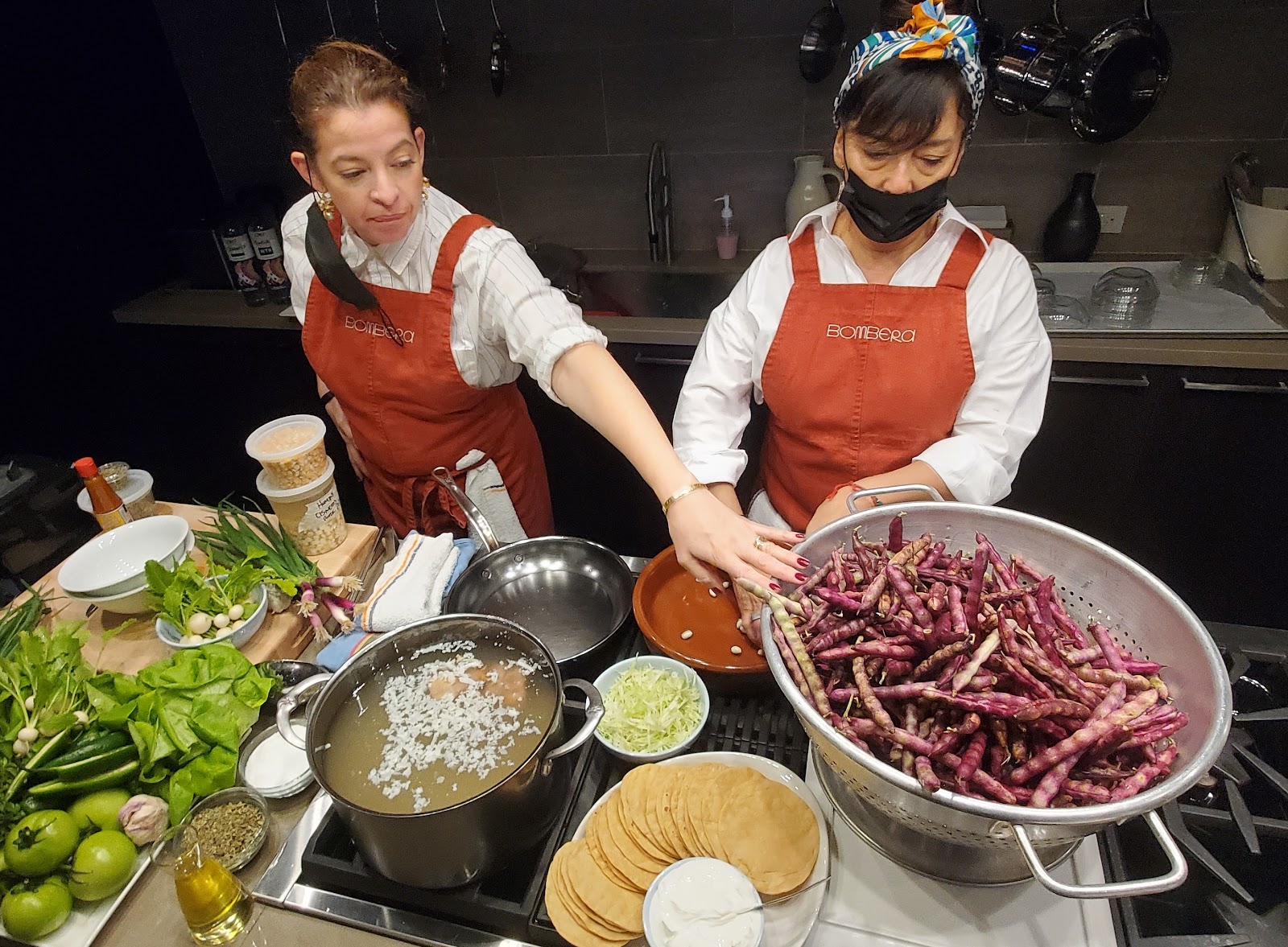 Chefs cooking at Worlds of Flavor