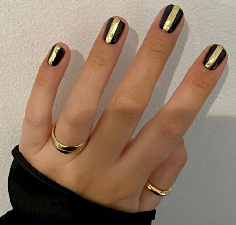 Bold bars black and gold nail designs