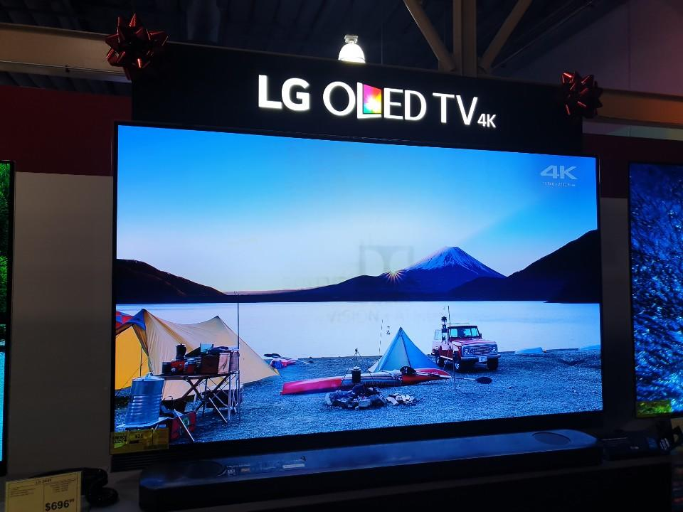 The Dobly logo is clearly visible on the LG OLED screen