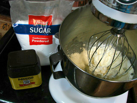 Frosting being made in a stand mixer 