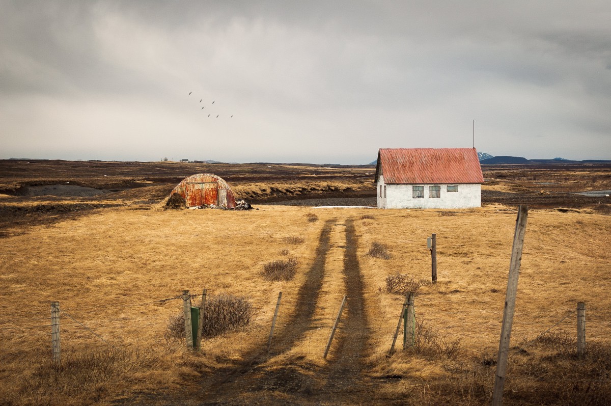 landscape sea coast nature grass sand rock horizon fence cloud sky sunset field farm prairie countryside house morning hill barn dawn land hut dry shack rural soil agriculture plain outdoors clouds fields grey sky rural area natural environment royalty free images rough pathway