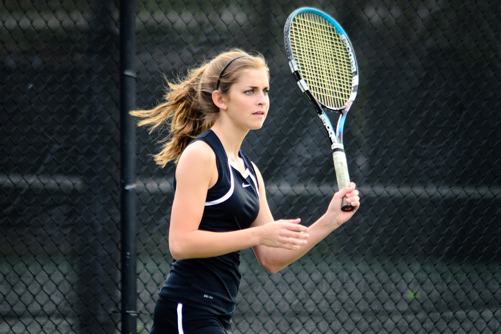 young woman playing tennis