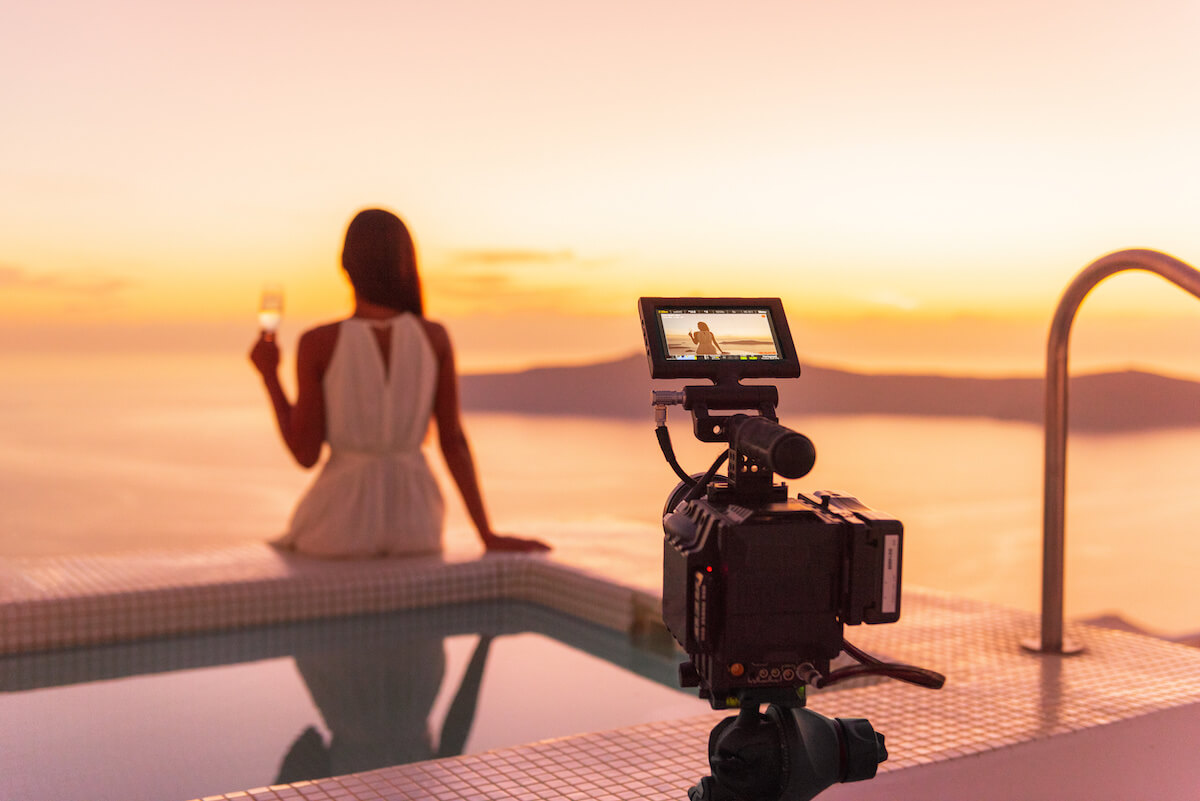 Types of influencers: Woman films herself sitting poolside