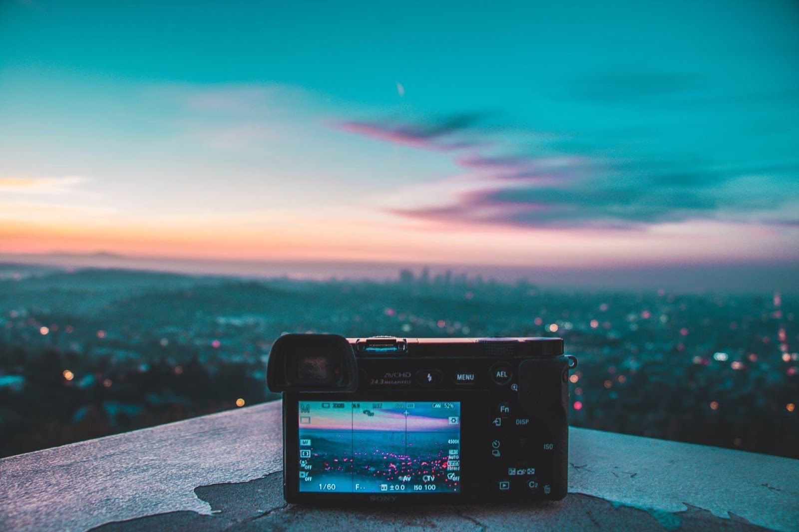 camera photographing he sunset