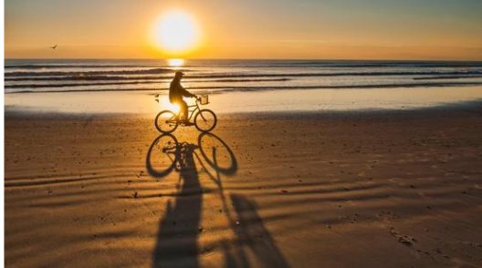 bicycle rider on a beach in Florida