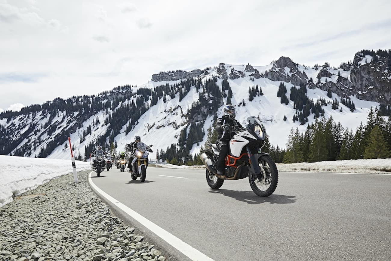 Group of motorcycles cruising on scenic mountain highway with breathtaking views