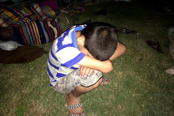 A young refugee rests after having fled from ISIS and arrived in Ankawa in the northern part of Erbil, Iraq. Credit: www.ankawa.com.